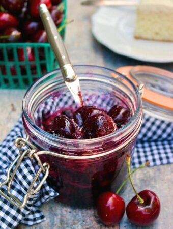 Homemade cherry compote in a glass jar