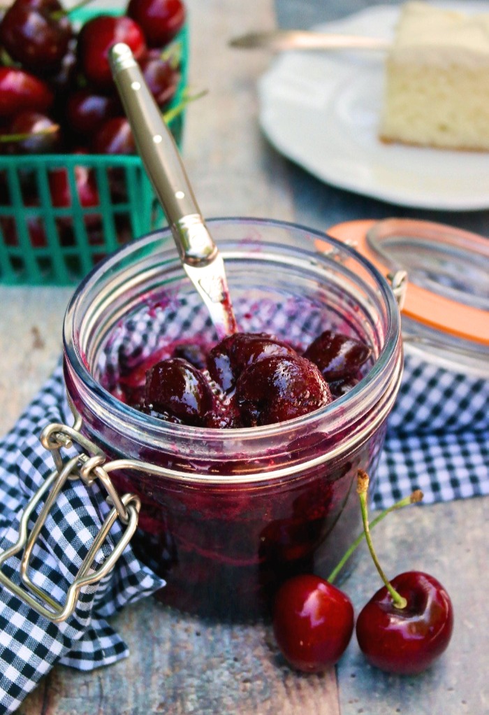 Homemade cherry compote in a glass jar