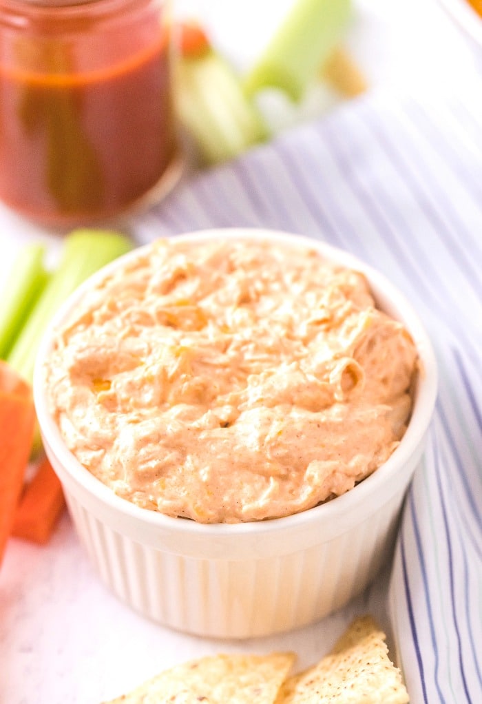 Keto buffalo chicken dip with cayenne sauce on the side. 