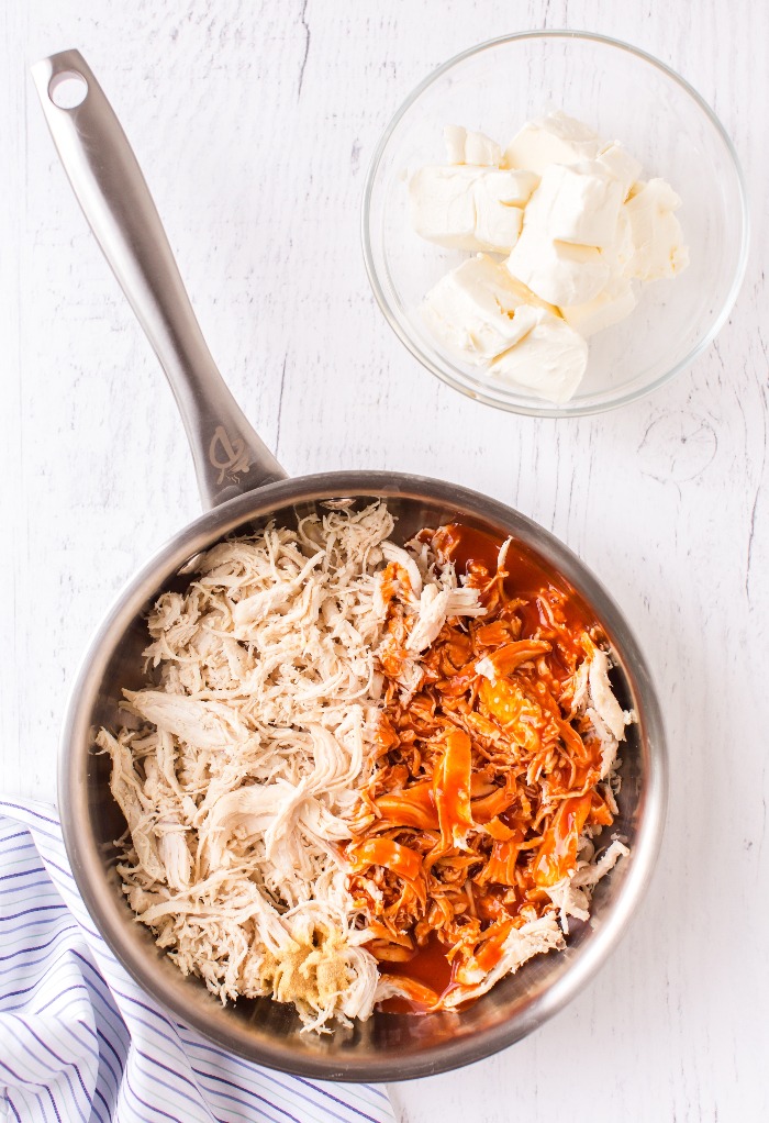 Shredded Chicken in a pan with cayenne sauce