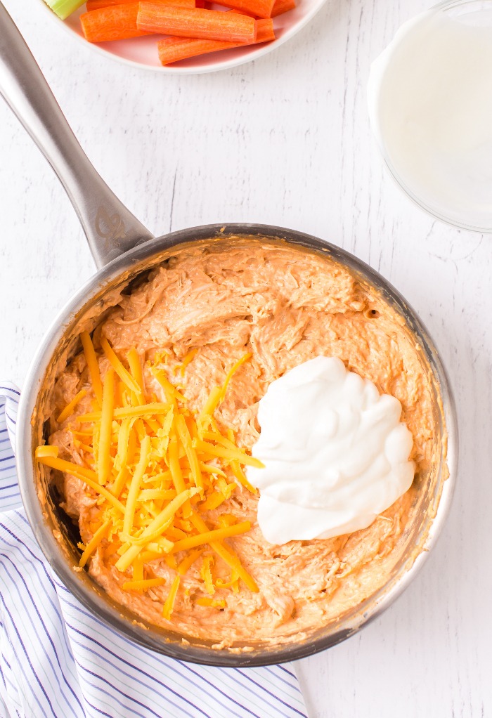 Here we add shredded cheese and Greek yogurt to give the dip an extra creamy texture.