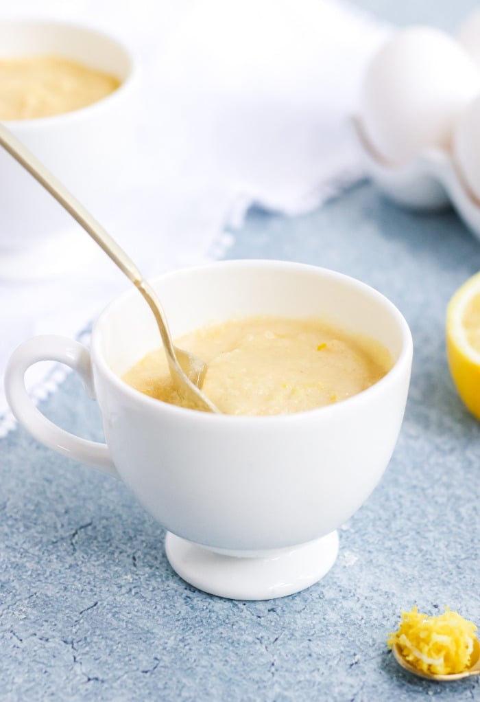 Mix in wet ingredients to make batter for lemon mug cake. 