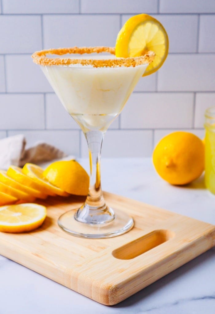 Limoncello martini on a cutting board with lemon slices