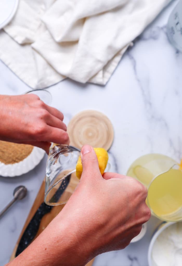 Add lemon juice to a rim of a martini glass before dipping in graham cracker crumbs