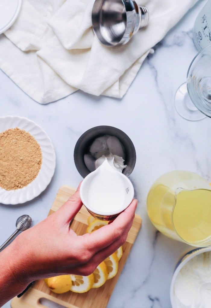 Add cream to cocktail shaker