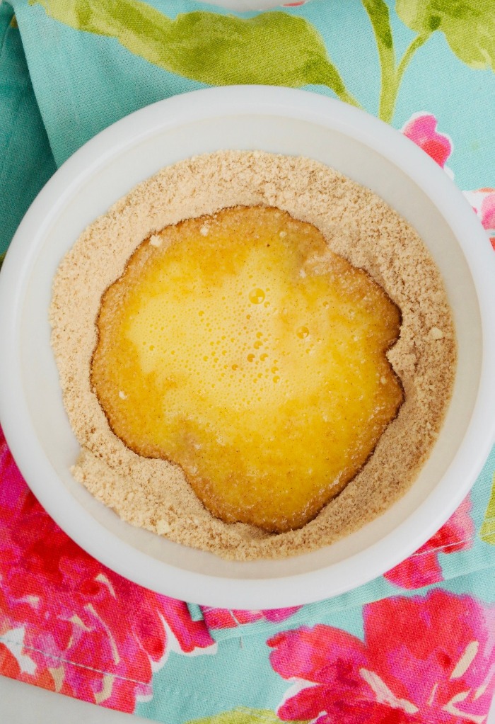 Wet and dry low carb pancake mix in a white bowl ready to mix together. 