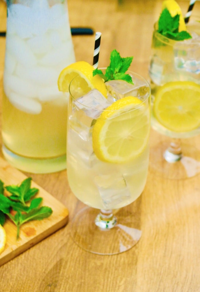 A spiked lemonade cocktail on a wooden table