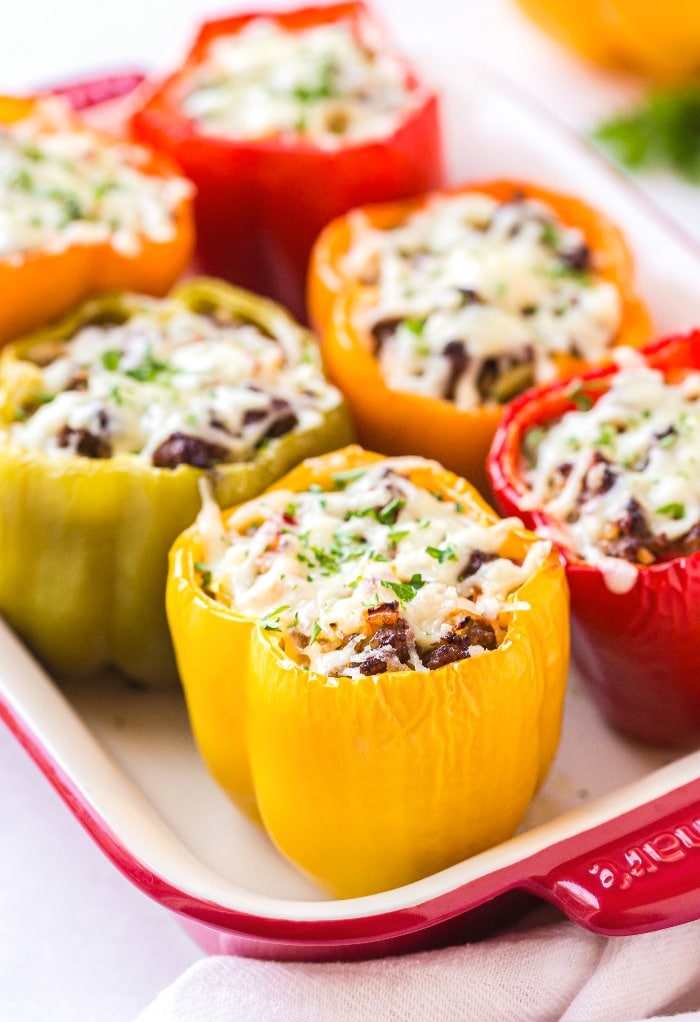 Casserole dish filled with stuffed peppers.