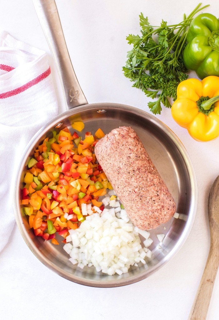 Ingredients in skillet to cook stuffing for Italian peppers