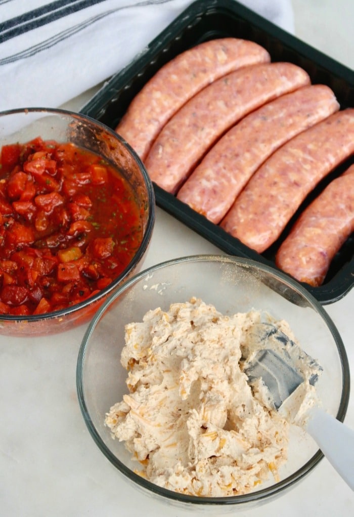 Cheese mix and chipotle sauce ready to assemble stuffed sausages