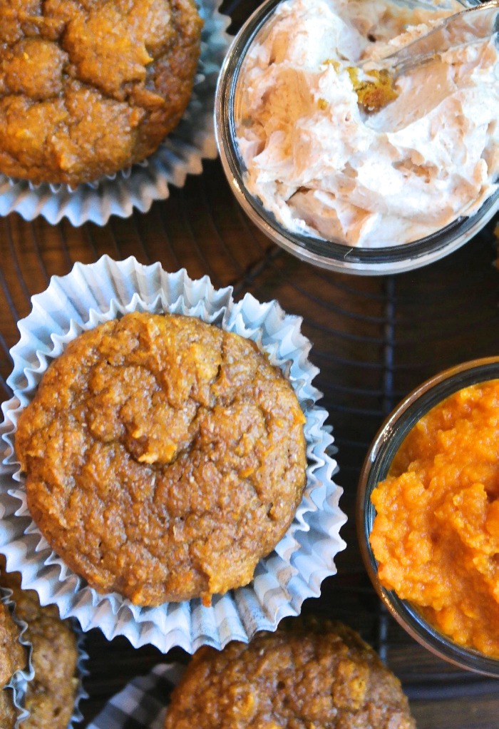 Top view of pumpkin protein muffin with cream cheese on the side. 