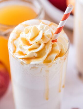 A homemade apple milkshake topped with whipped cream ready to be enjoyed.