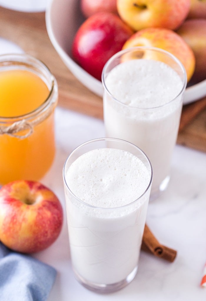 Blended vanilla milkshake in clear glasses. 