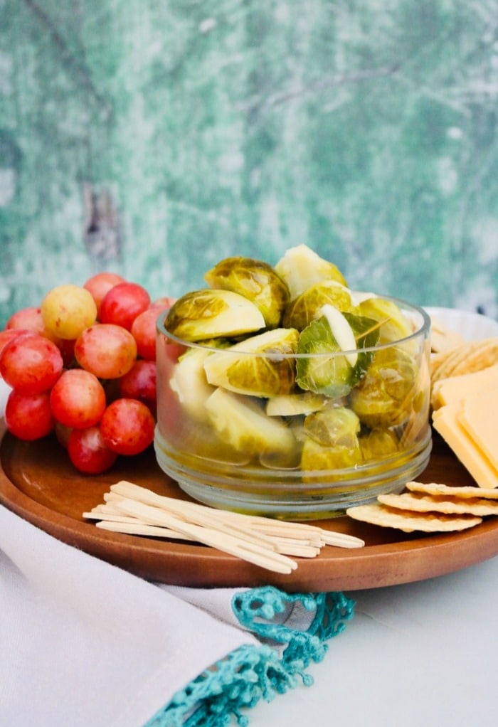 An appetizer platter filled with a variety of finger snacks. 