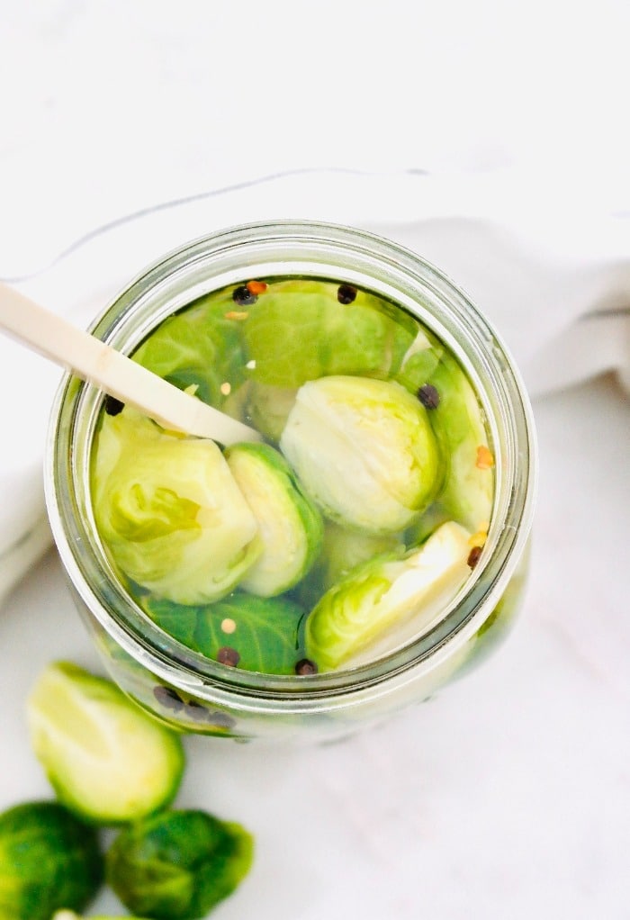 Top view of picked vegetables in a Mason jar.