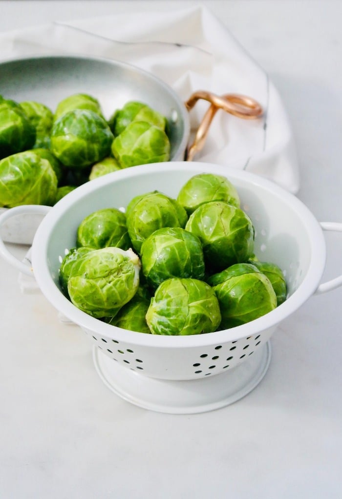 Here are brussels sprouts in a colander after being cleaned.  