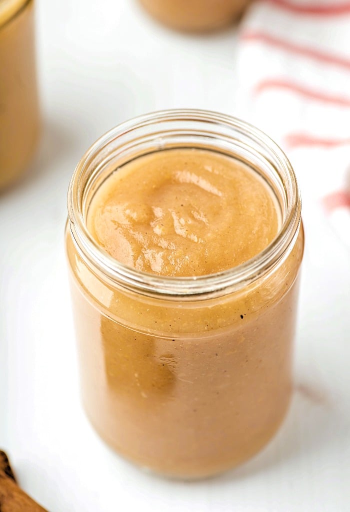 Homemade applesauce in a glass jar. 