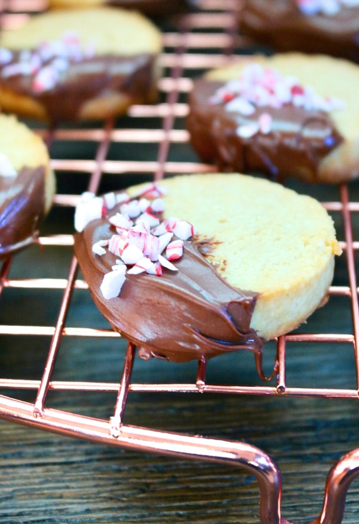 Close up view of sliced keto Christmas cookie dipped in chocolate. 