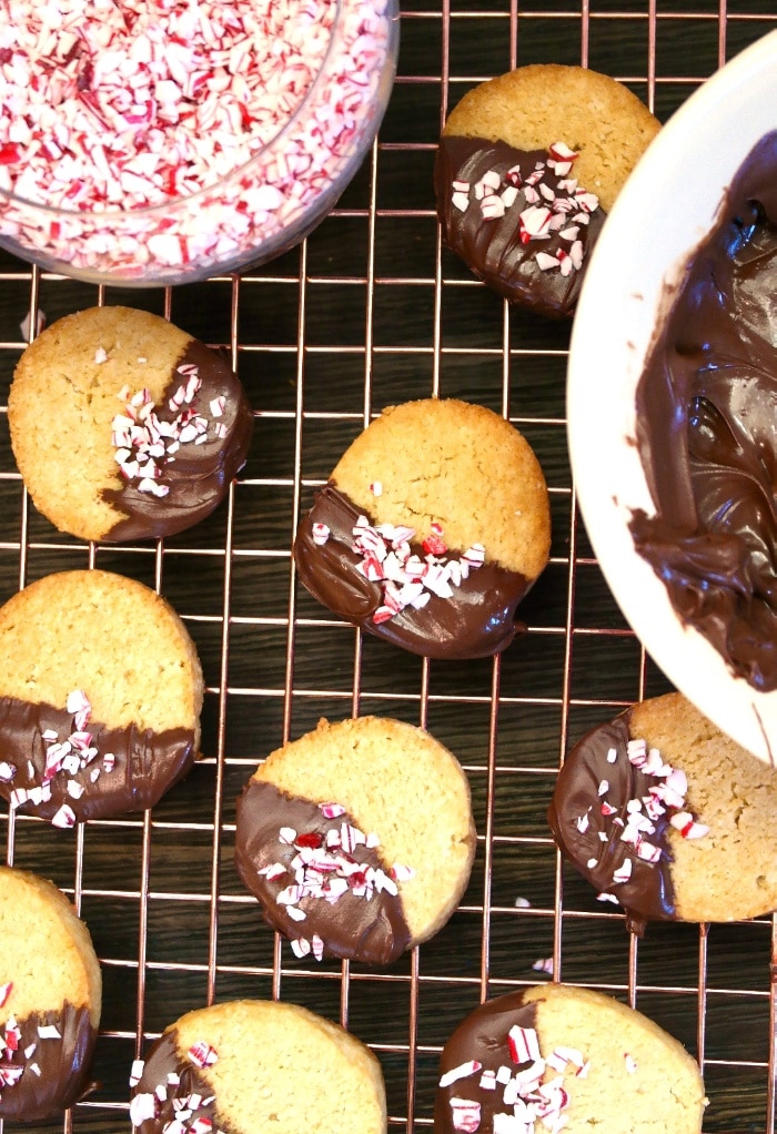 Chocolate dipped cookies with peppermint candy.