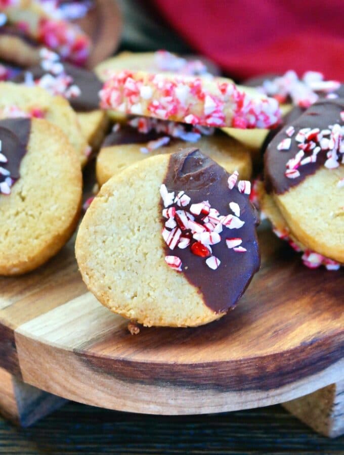 Sliced Christmas cookies on a wooden tray ready to eat.