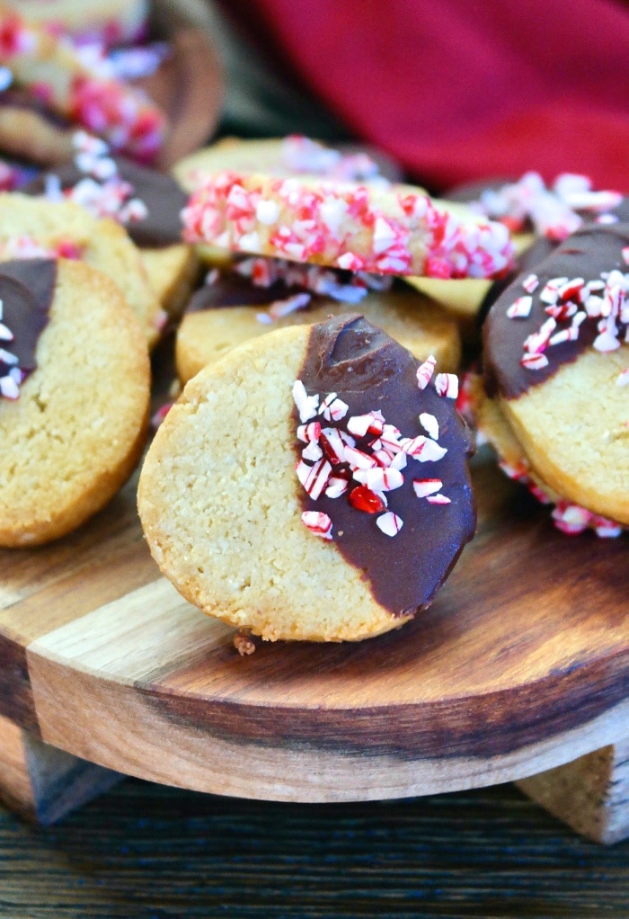 Sliced Christmas cookies on a wooden tray ready to eat.