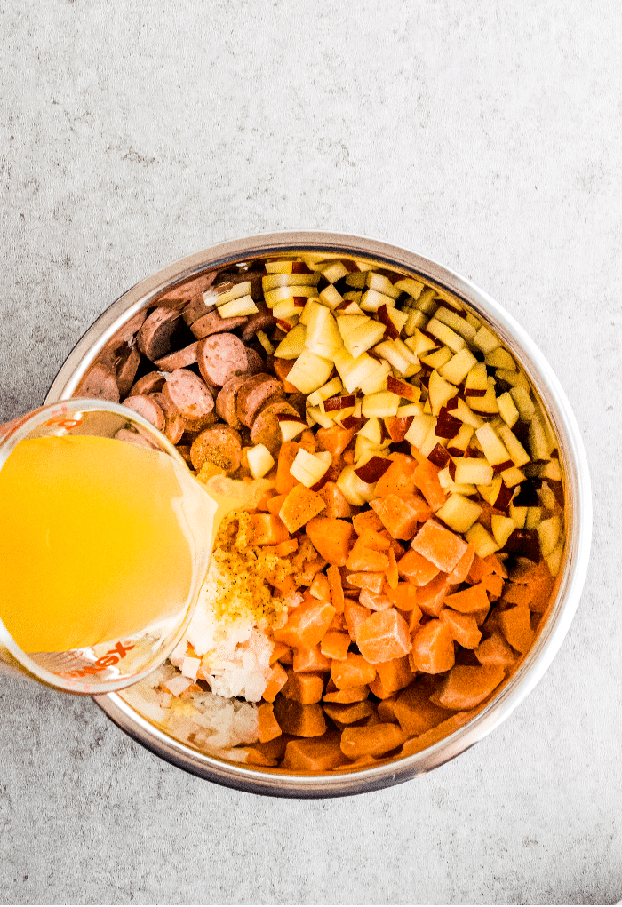 All ingredients added to an Instant Pot to make sweet potato breakfast bowls. 