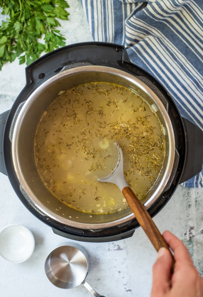 In this lemon chicken orzo soup recipe we remove the chicken to shred then stir in the orzo pasta. 