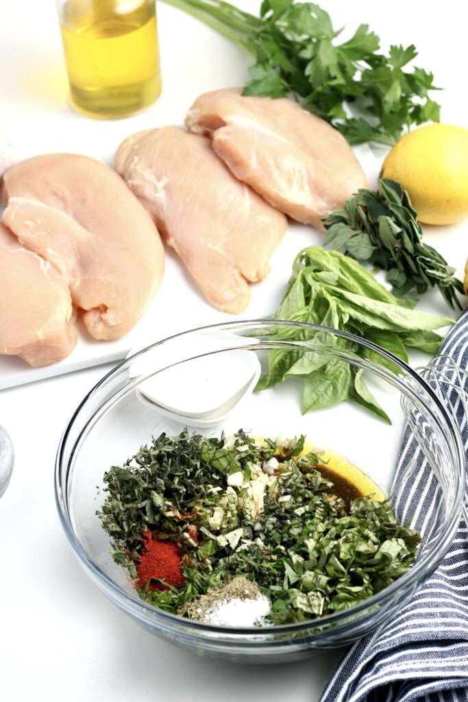 Chicken marinade for chicken breasts in a clear mixing bowl.