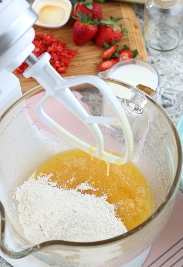 Wet and dry ingredients to make vanilla cupcakes in a stand mixer.  