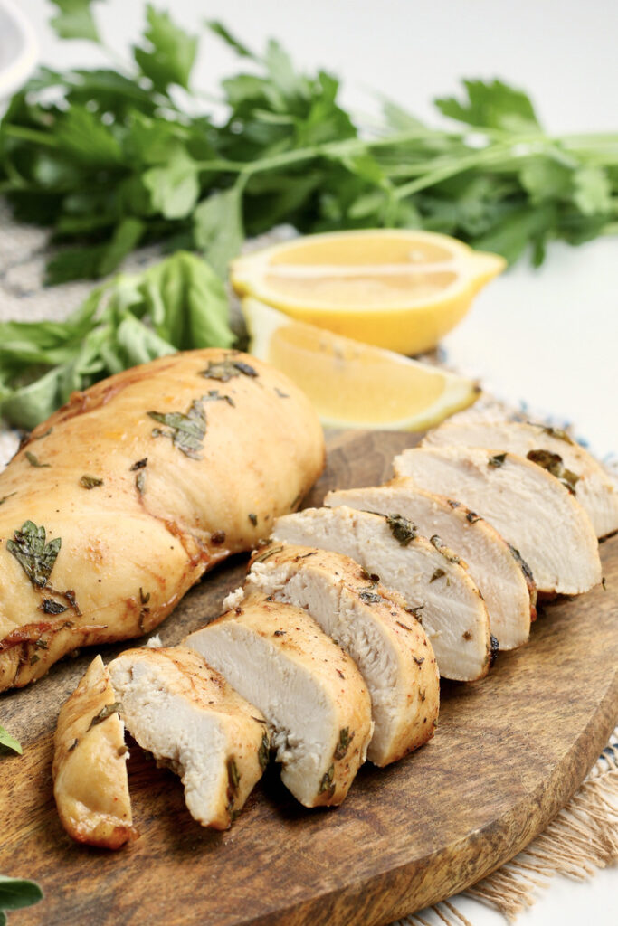 Sliced chicken breasts on a cutting board ready to enjoy. 