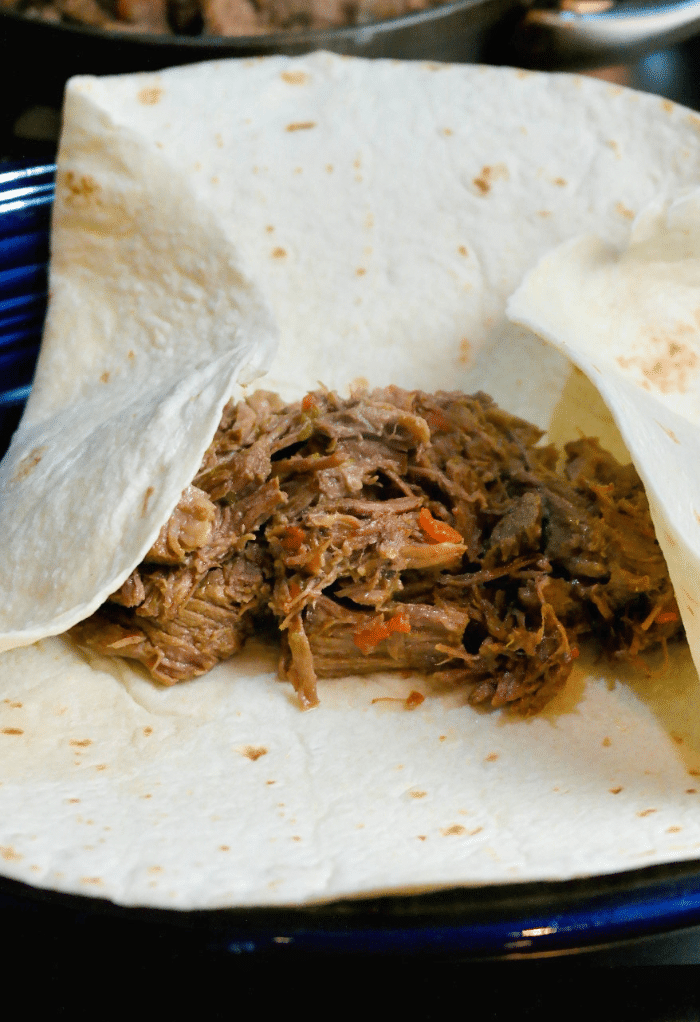 Tortilla filled with shredded beef. 