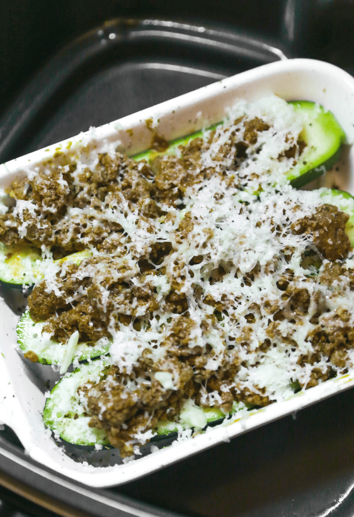 Zucchini placed in an air fryer ready to be cooked. 