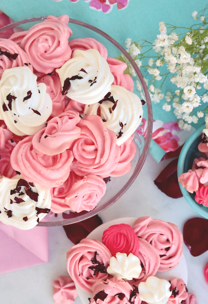 Overhead view of meringue cookies on platters for serving. 