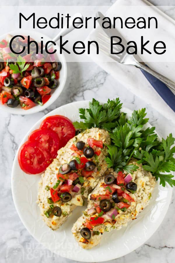 top view of two cooked skinless chicken topped with olive salsa and side of tomato slices- low carb chicken recipes