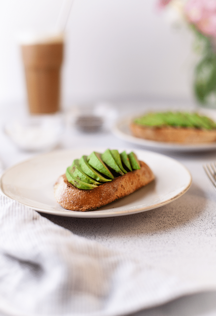 Sliced fresh avocado on sourdough bread. 