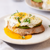 Close view of sunny side egg over toast.