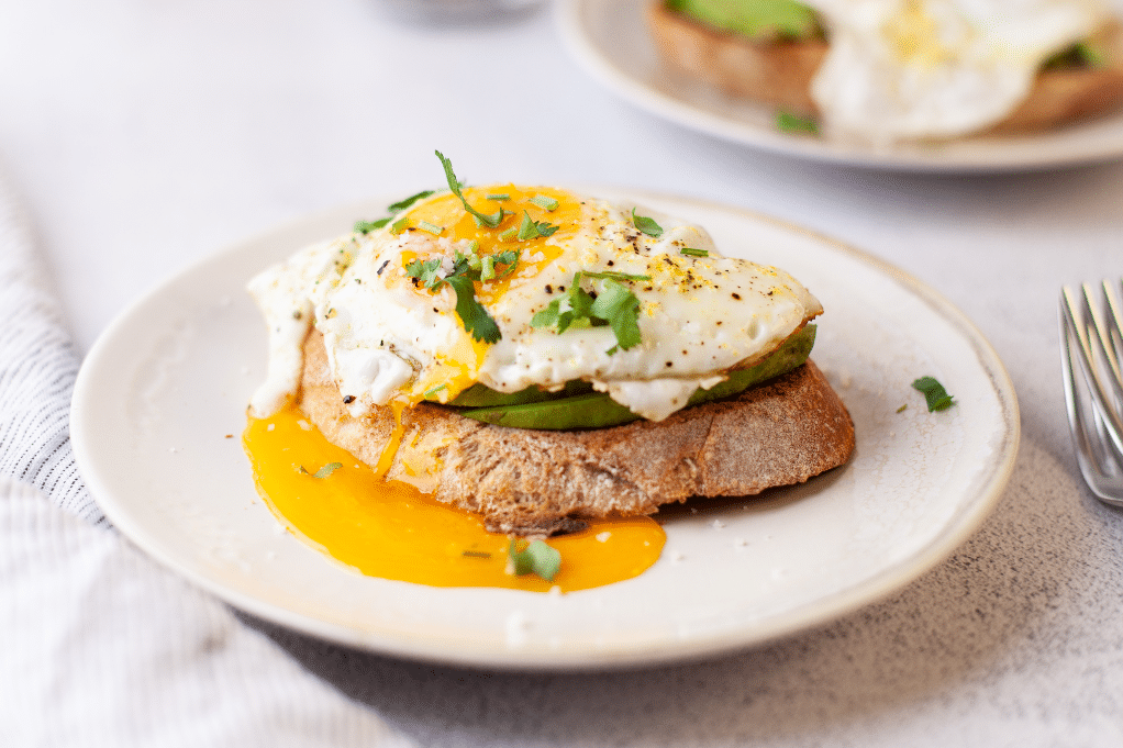 Close view of sunny side egg over toast. 