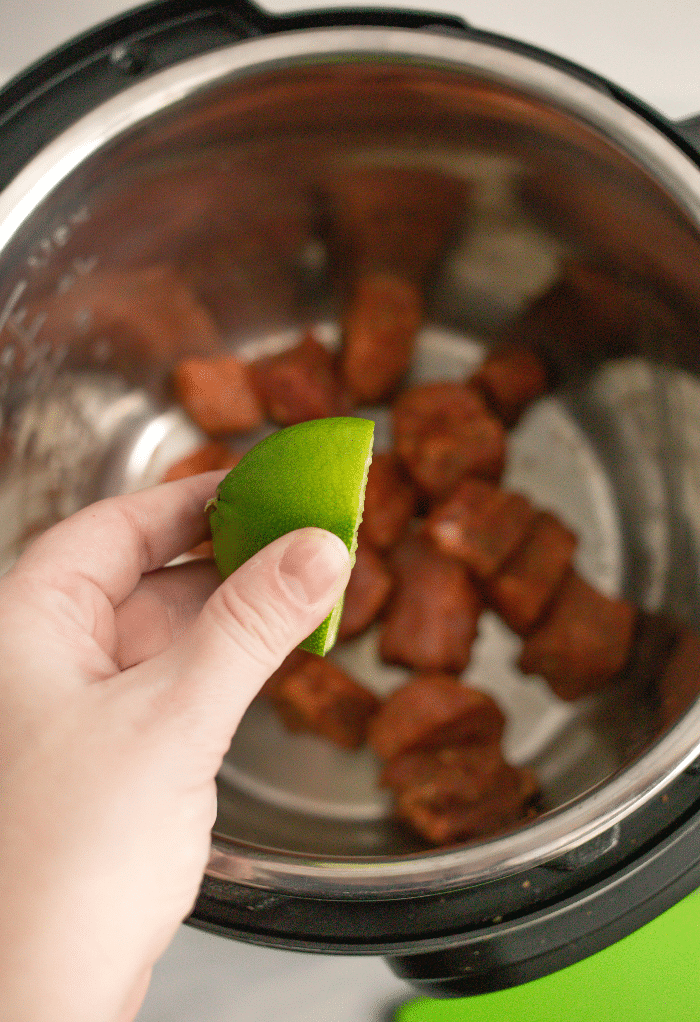 Line juice squeezed over cooked pork. 