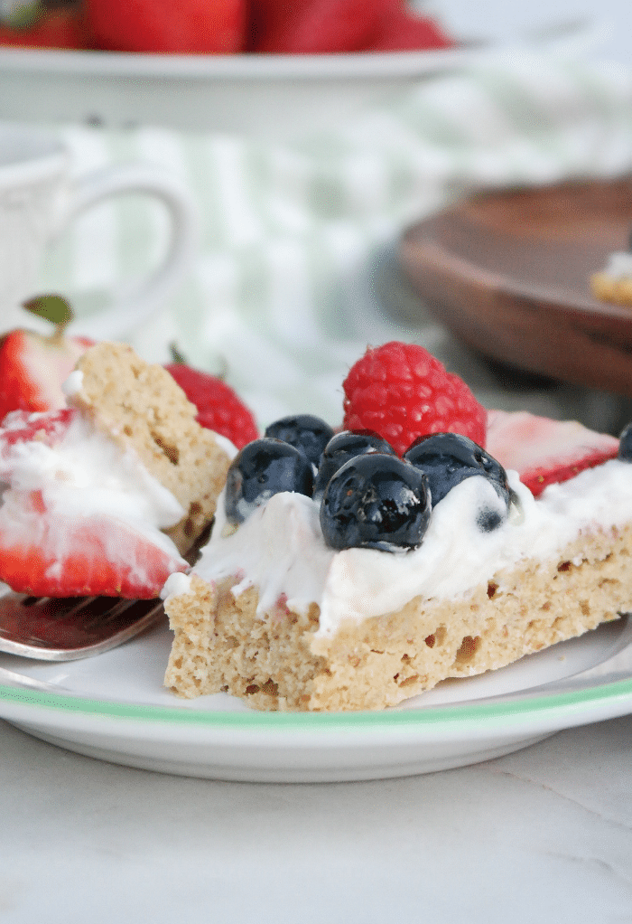 Dessert pizza with a piece cut into with a fork. 