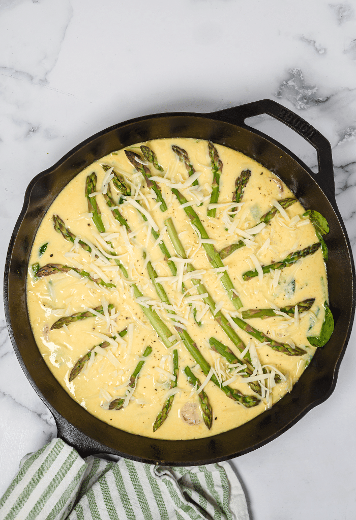 Here is the egg mix topped with fresh asparagus. 