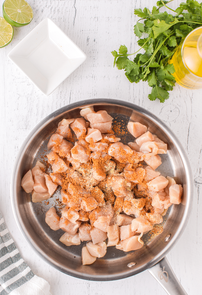 Seasoned raw chicken seasoned while cooking.