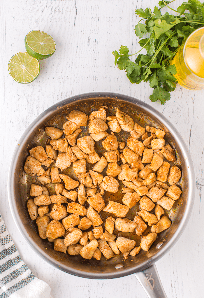 Cooked chicken in a skillet.