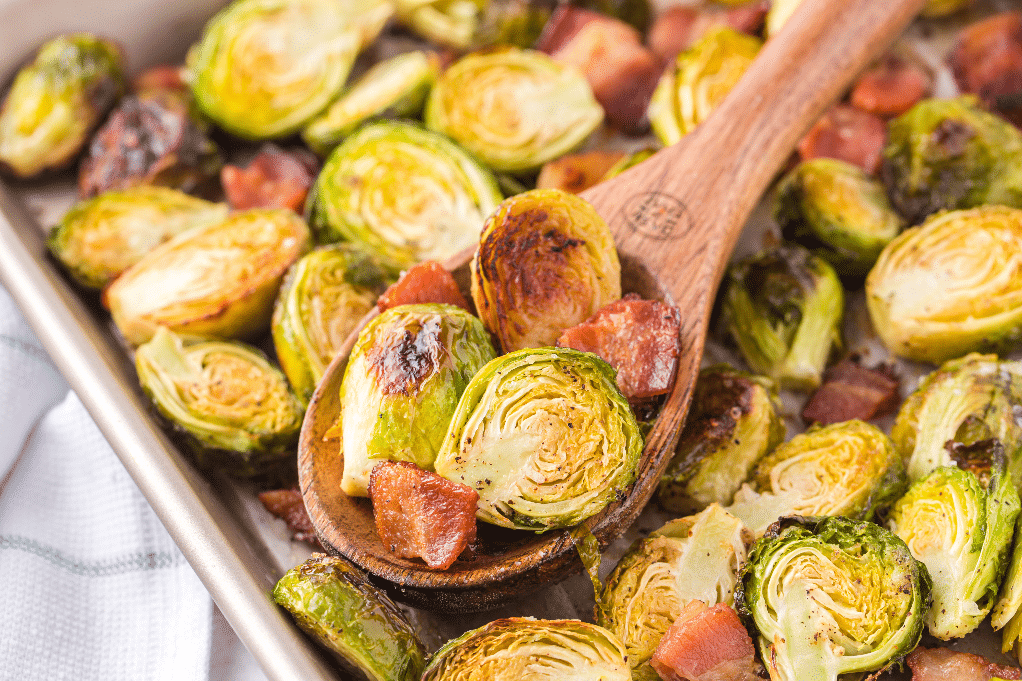 Brussels sprouts roasted on a baking tray ready to eat. 