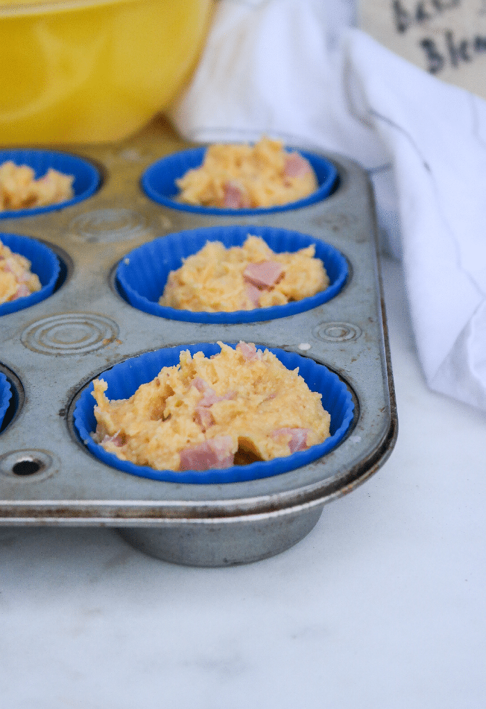 Muffin batter in baking pan ready to go in the oven.