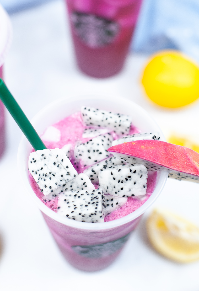 Top view of mango dragon fruit refresher beverage with fresh fruit.