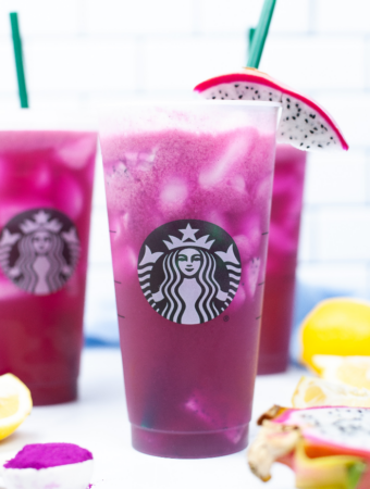 Copycat mango dragonfruit refresher beverage from Starbucks in a tall cup with a straw.