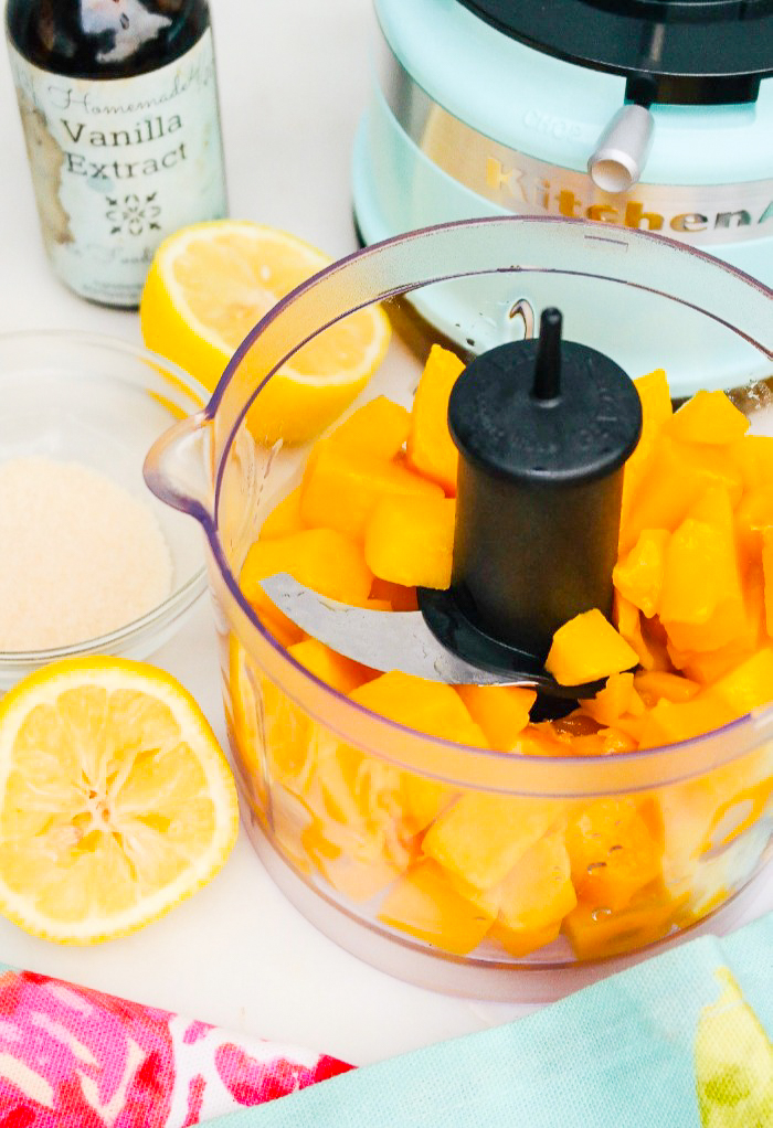 Diced mango in a food processor.