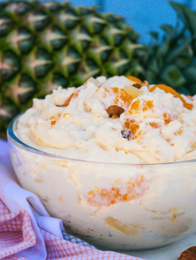 A clear bowl of orange fluff salad.