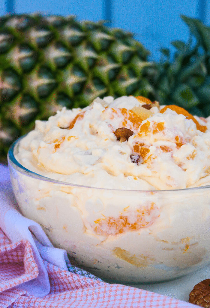 A clear bowl of orange fluff salad.