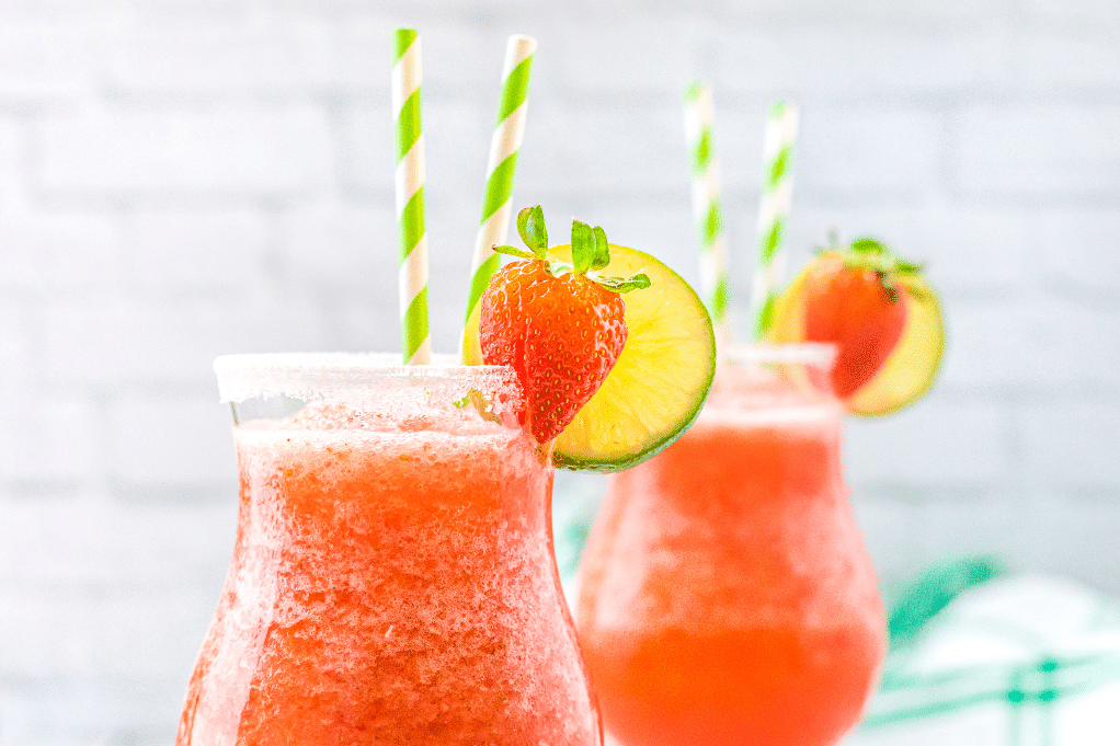 Close view of frozen strawberry daiquiri in clear glasses. 